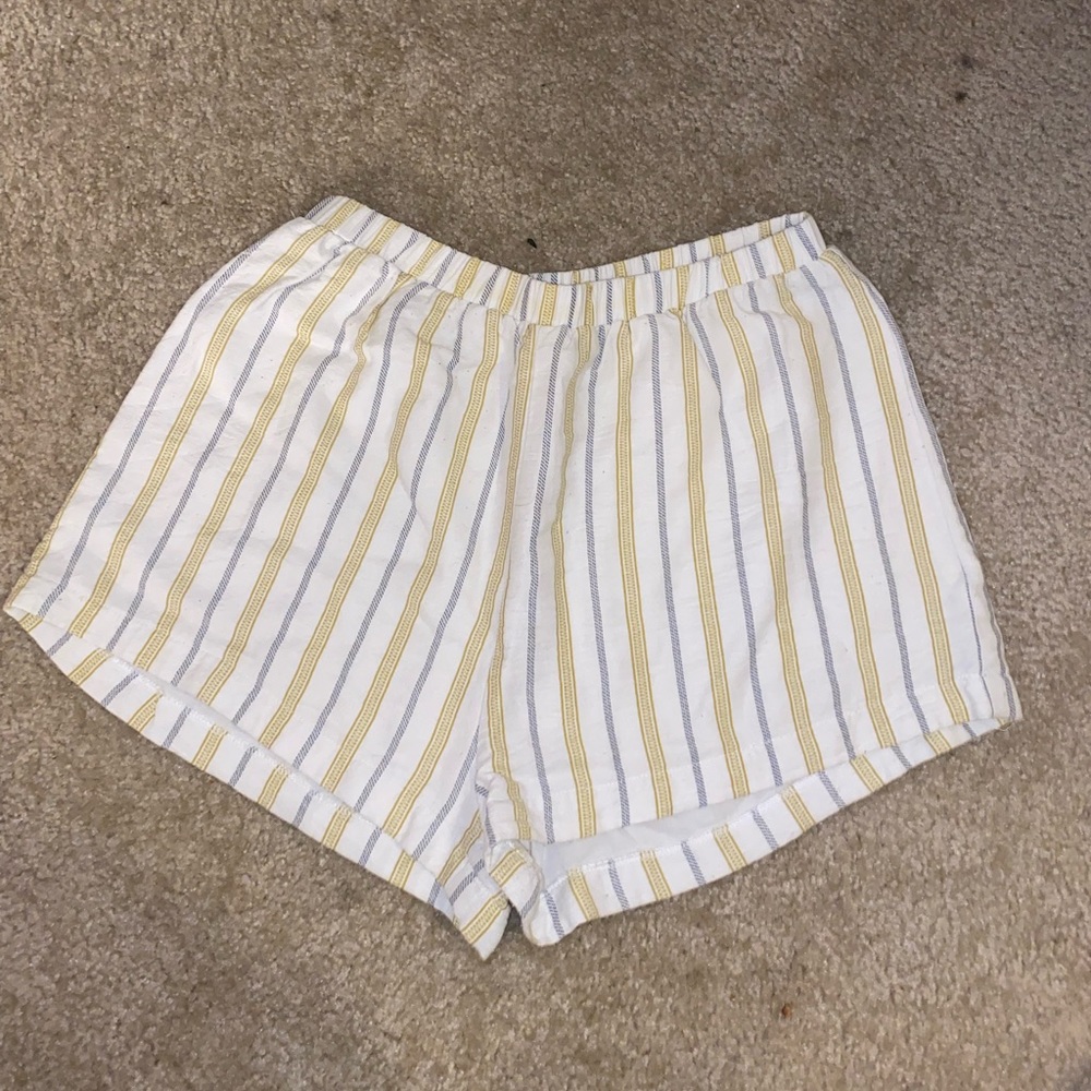 Medium white shorts with yellow and blue stripes size 4